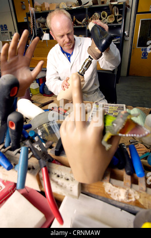 A technician building a prosthetic leg at a prosthesis workshop. Stock Photo