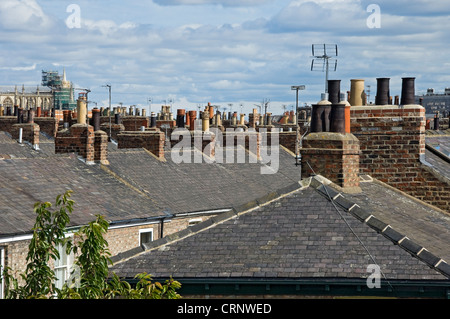 Chimney pots and television aerials on roof tops. Stock Photo