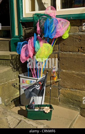 Small childrens fishing nets for sale outside a shop. Stock Photo