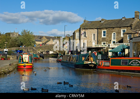 Narrow boats moored in the canal basin at Skipton on the Leeds and Liverpool Canal. Stock Photo