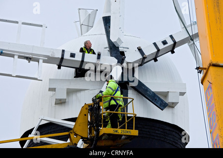 Workmen replacing the sails on Holgate Windmill, a Grade II listed building built in 1770, the last surviving mill in York. Stock Photo