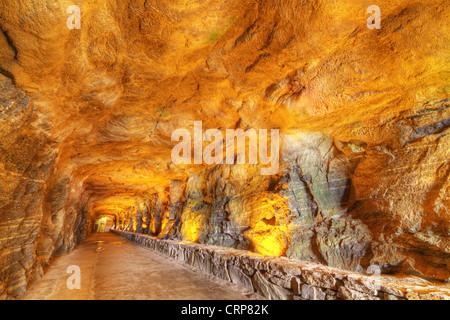 Interior of a cave tunnel at Chimney Rock Park in North Carolina, USA.