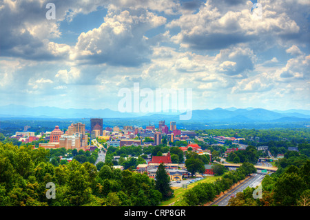 Asheville, North Carolina skyline nestled in the Blue Ridge Mountains.
