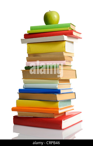 stack of books with green apple, isolated on white background Stock Photo