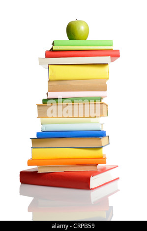 stack of books with green apple, isolated on white background Stock Photo