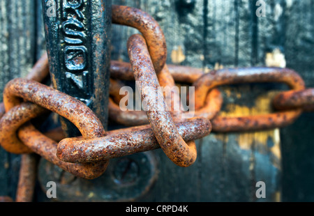 Close-up of a rusty padlock chain. Stock Photo
