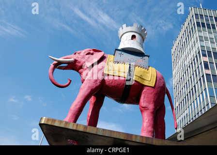 A model of a pink elephant carrying a castle outside Elephant and Castle Shopping Centre. Stock Photo