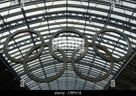 A giant set of Olympic rings hanging in St Pancras International Station. Stock Photo
