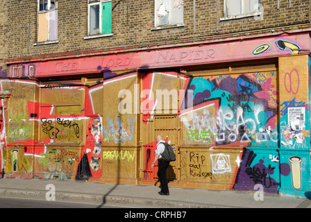 Graffiti covering the walls and boards of The Lord Napier, a derelict pub in Hackney Wick. Stock Photo