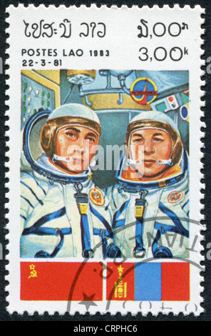 LAOS-CIRCA 1983: A stamp printed in the Laos, a symbol INTERCOSMOS -Space Cooperation Program of the USSR - Mongolia, circa 1983 Stock Photo