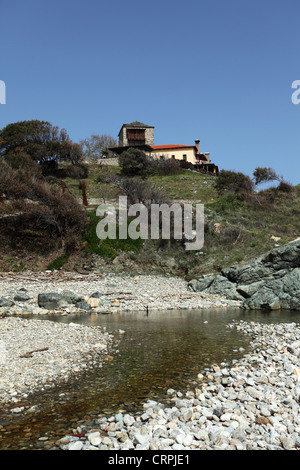 The stoney beach by the skete of Mylopotamos at Mount Athos, Greece. Stock Photo