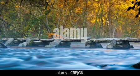 The Tarr Steps, a prehistoric clapper bridge across the River Barle in the Exmoor National Park. Stock Photo