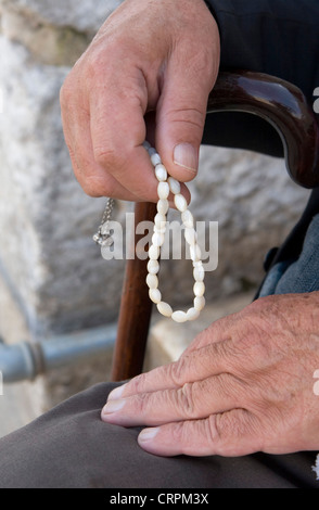 Arab man fingers Muslim prayer beads, Jerusalem, Israel Stock Photo