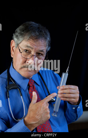 Crazy Doctor With Huge Needle And Syringe Stock Photo Alamy