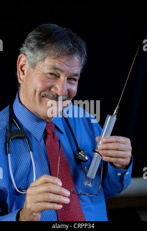 Crazy Doctor With Huge Needle And Syringe Stock Photo Alamy