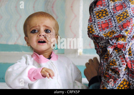 Mother with child in Indra Gandhi Hospital, Kabul. Stock Photo
