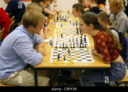 Young people at chess on the You fair in Essen Stock Photo