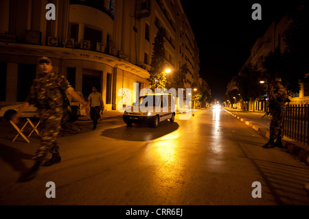 Tunisian soldiers man a checkpoint in downtown Tunis during the curfew imposed after salafist riots on 12th of June 2012 Stock Photo