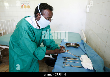 Medical staff lay out sterilized medical equipment in a hospital ward. Stock Photo