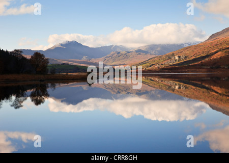 Reflections in Llynnau Mymbyr lake with view to Mount Snowdon Horseshoe in Snowdonia National Park in autumn North Wales UK Stock Photo