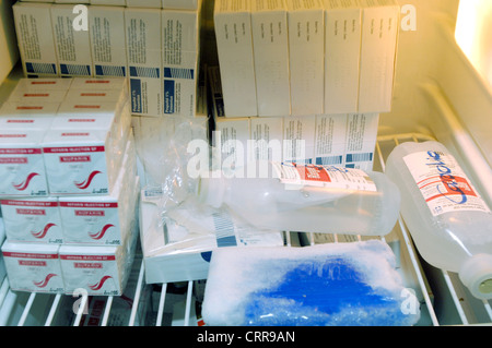 Various drugs and solution bags stored in a hospital fridge. Stock Photo