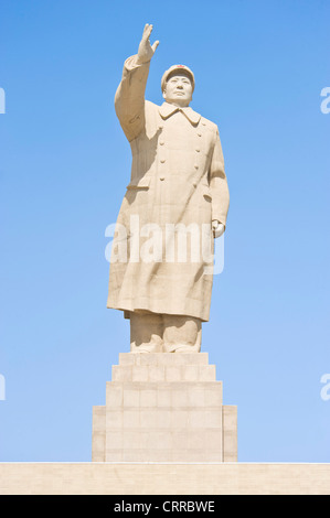 The 18mtr high statue of former Chinese leader Mao Zedong opposite the city square in Kashgar. Stock Photo