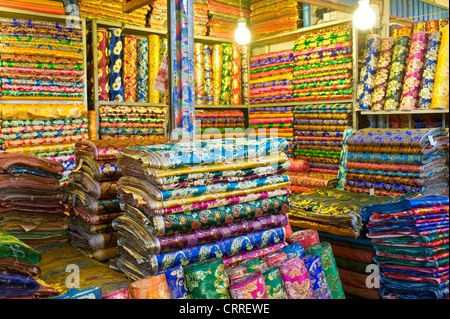 Colourful rolls of silk fabric in the Western-Central Asia Market ( Bazaar) of Kashgar. Stock Photo
