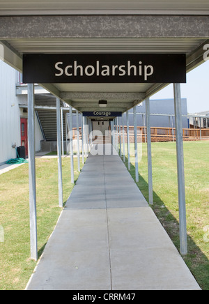 Signs with positive phrases on campus of KIPP Sunnyside High school, a