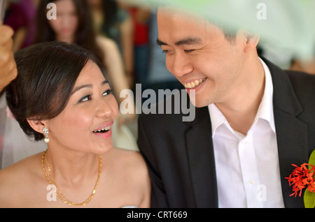 asian bride during their actual day wedding ,focus on bride's eyes Stock Photo