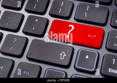 concepts of questions or computer errors, with a question on enter key of keyboard. Stock Photo
