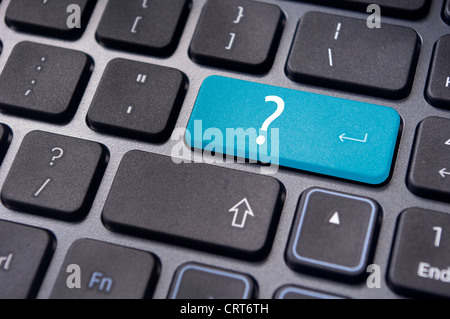 concepts of questions or computer errors, with a question on enter key of keyboard. Stock Photo