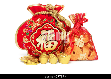 Two Chinese New Year Gift Bags and Gold Ingots on White Background Stock Photo