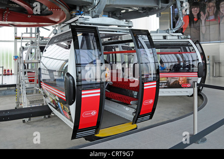 Boarding platform and Emirates Air Line sponsored cable car cabin for crossing River Thames to Greenwich Peninsula Stock Photo