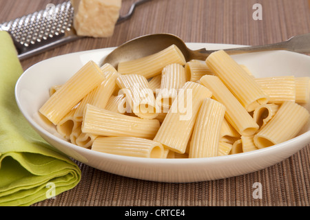 Italian Pasta - Big Penne rigate with Butter on a white plate Stock Photo