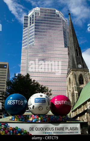 The KPMG tower at the rear of the Christ Church Anglican Cathedral on Saint Catherine Street in Montreal, Quebec Stock Photo