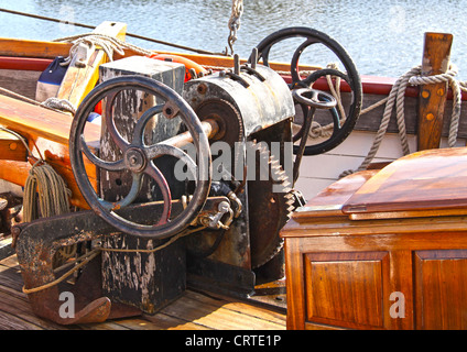 traditional winch on board sailing vessel bright work on traditional vessel old sailing ship deck equipment anchor winch Stock Photo