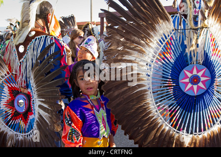 Fort Washakie, Wyoming -  Young participant in a powwow checking the regalia of an adult dancer during the Indian Days, an annua Stock Photo