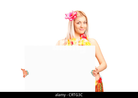 An attractive young woman dressed in a hawaiian costume holding a panel isolated on white background Stock Photo