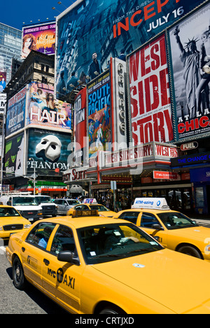 Times Square New York Yellow Taxi, New York City Daytime Broadway Theater Billboards and Yellow Taxis Stock Photo