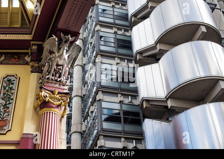 Silver Dragon column roof supports. Leadenhall market and The Lloyds building, East End, London, England Stock Photo