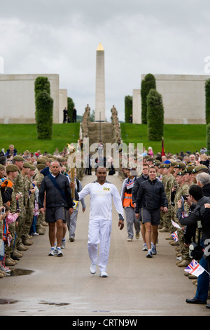 Cpl Johnson Beharry VC carrying the Olympic Torch at The National Memorial Arboretum on Armed Forces Day 2012 Stock Photo