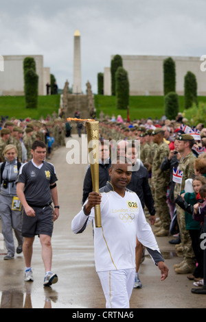 Cpl Johnson Beharry VC carrying the Olympic Torch at The National Memorial Arboretum on Armed Forces Day 2012 Stock Photo