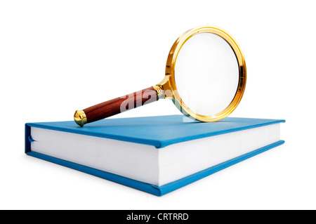 Magnifying glass over the stack of books Stock Photo