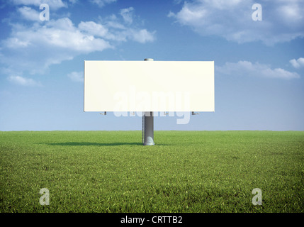 Ad billboard standing in a field of grass Stock Photo