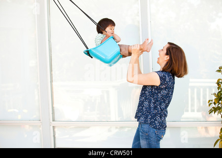 boy swinging Stock Photo