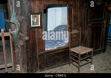 old times farmhouse - interior of an old country house with fireplace and kitchen Stock Photo 