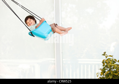 boy swinging Stock Photo