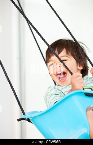boy swinging Stock Photo