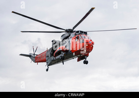 Royal Navy Sea King helicopter Rescue 177 in flight Stock Photo