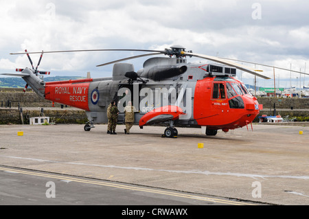 Royal Navy Sea King helicopter Rescue 177 on a landing site Stock Photo